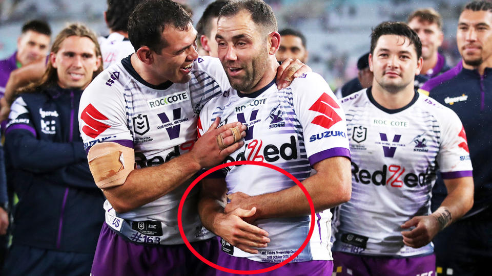 Cameron Smith, pictured here cradling his ribs after the NRL grand final.