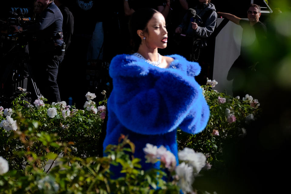 Cardi B walked the show in a head-turning blue furry coat.