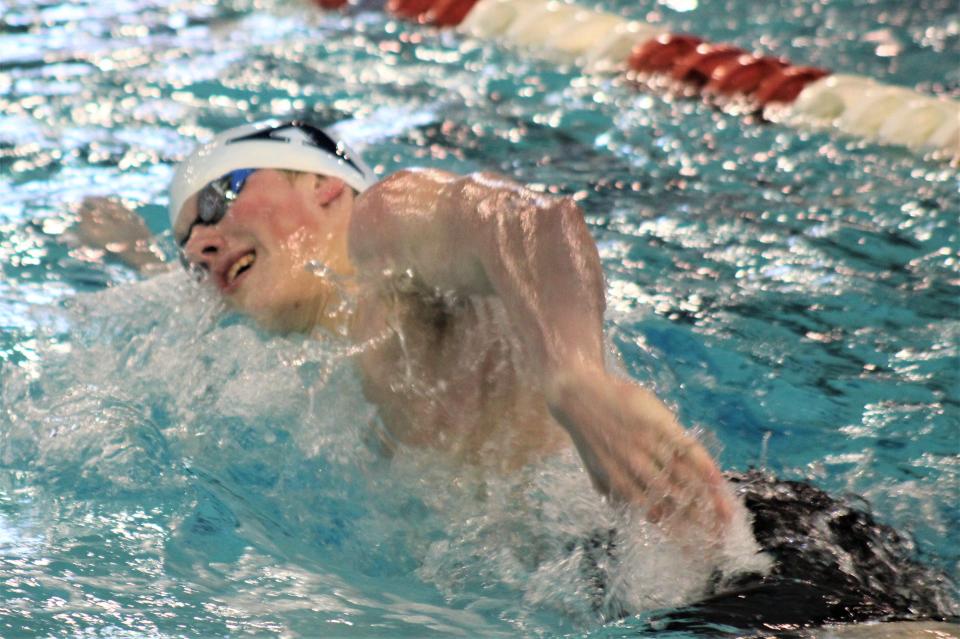 St. Xavier junior Thackston McMullan on his way to the win in the 500 freestyle during the OHSAA Southwest District Division I swimming championships Feb. 18, 2023 at Miami University