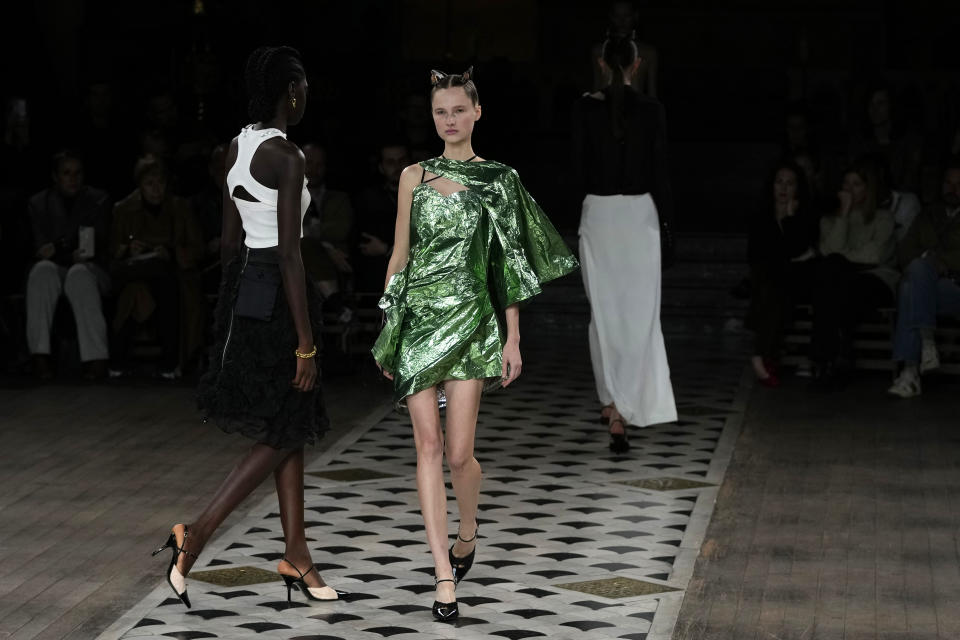 A model wears a creation for Undercover ready-to-wear Spring/Summer 2023 fashion collection presented Wednesday, Sept. 28, 2022 at the American cathedral in Paris. (AP Photo/Francois Mori)