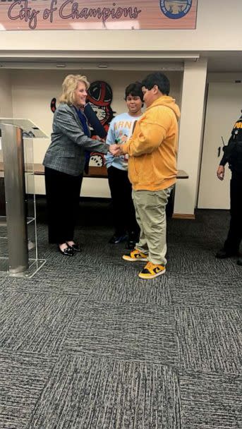 PHOTO: Kathy Catazaro-Perry, the mayor of Massillon, Ohio, recognized Jermel and Jordan Taylor and presented them with pins during a March 6 ceremony. (Courtesy Crystal Thompson)