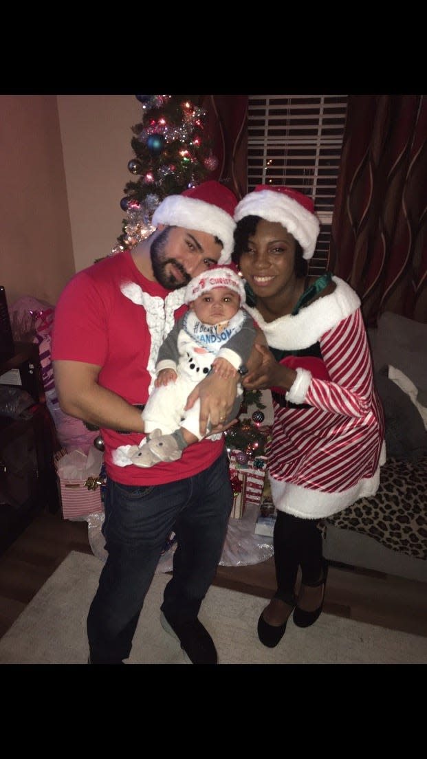 Southern Pines resident Jazz Murcia, her husband Alexander, and their son, Aiden pose for a photo on Christmas Day, 2021. Like thousands of others, the family lost power after coordinated attacks on two substations in Moore County.