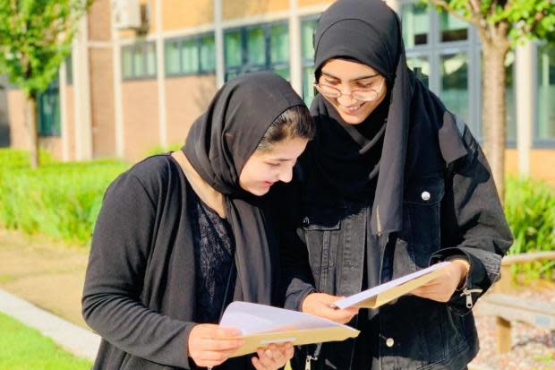 Tauheedul students Mayra (L) and Arhama (R) opening their results last year