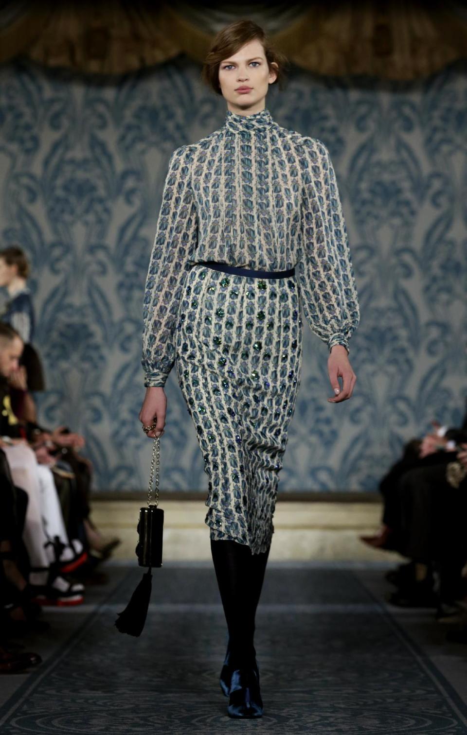 The Tory Burch Fall 2013 collection is modeled during Fashion Week in New York on Tuesday, Feb. 12, 2013. (AP Photo/Richard Drew)