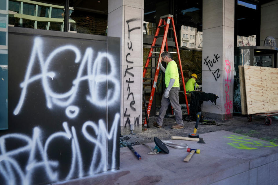 ACAB can be seen spray painted outside a business. Source: Getty