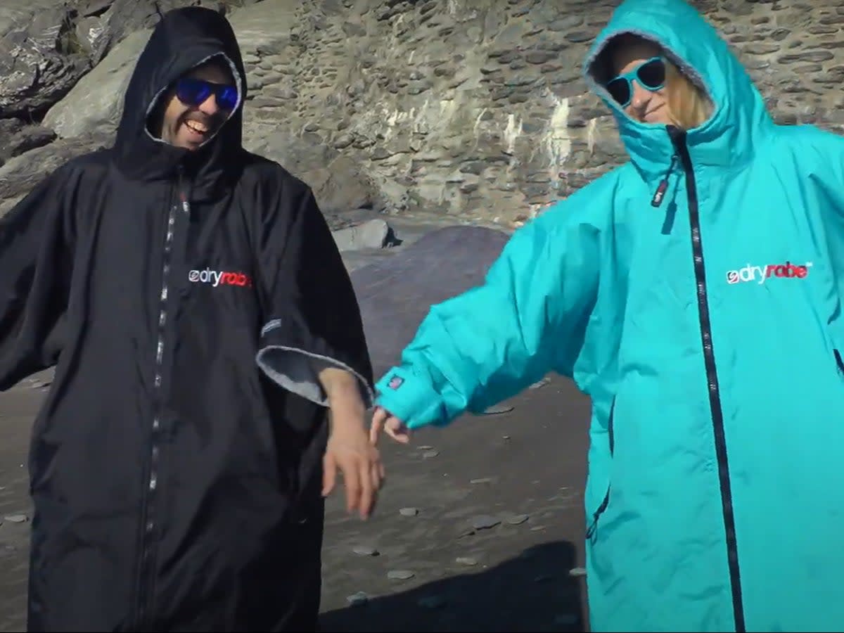 Dryrobes have exploded in popularity for activities like cold-water swimming and paddleboarding (YouTube/SUPboarder)