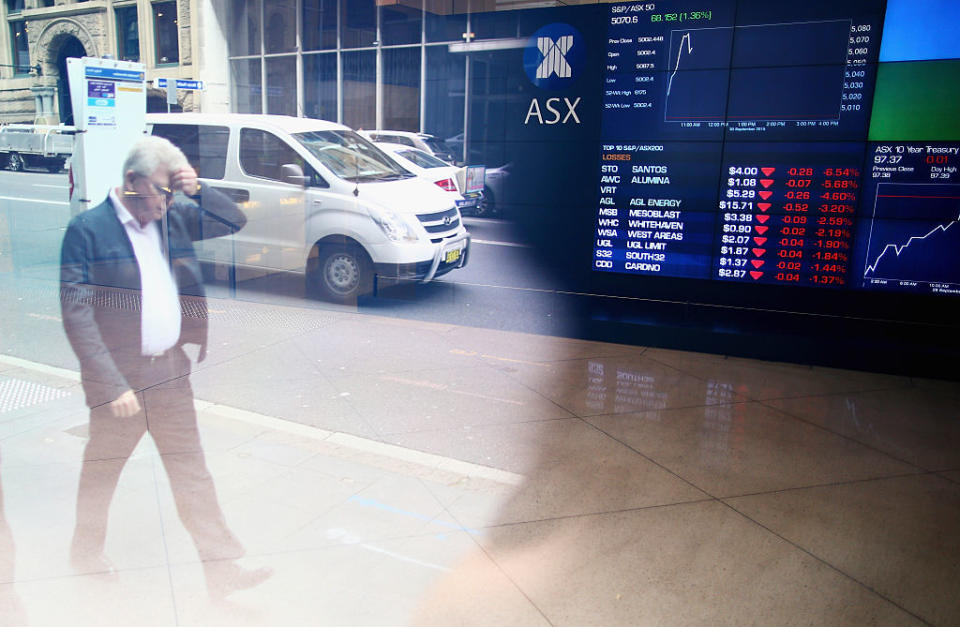 A man walks past the ASX Exchange Centre on September 30, 2015 in Sydney, Australia. 