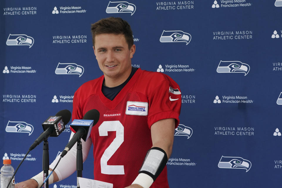 Seattle Seahawks quarterback Drew Lock talks to reporters after NFL football practice Wednesday, June 8, 2022, in Renton, Wash. (AP Photo/Ted S. Warren)