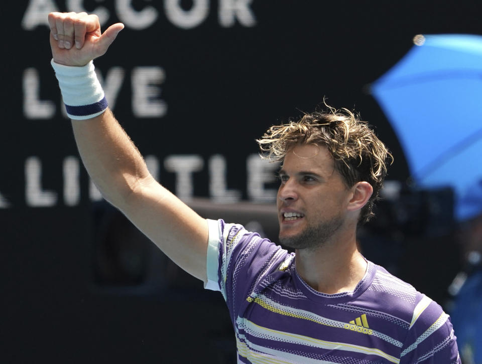 Austria's Dominic Thiem celebrates after defeating France's Gael Monfils in their fourth round singles match at the Australian Open tennis championship in Melbourne, Australia, Monday, Jan. 27, 2020. (AP Photo/Lee Jin-man)