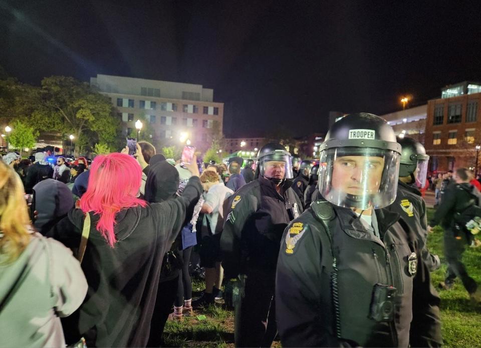 Police try to break up protests Thursday at Ohio State University.