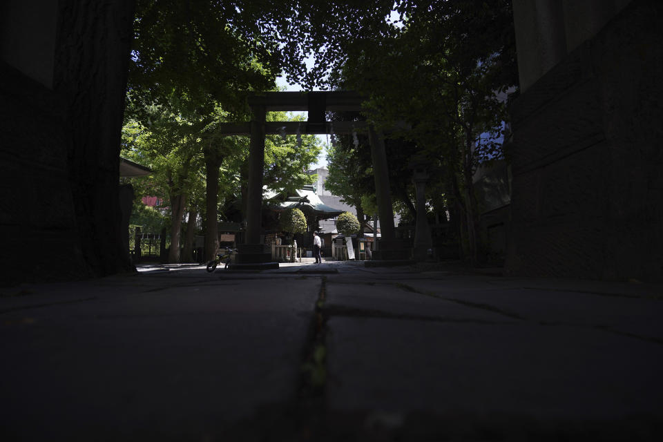 In this May 8, 2020, photo, Onoterusaki Shrine is seen in Tokyo. The shrine offered a 10-day trial of "online shrine" visit program allowing its visitors to join rituals from their homes. The shrine also accepted from worshipers their prayer messages, which were printed on a virtual wooden tablet each and offered to the Shinto gods to keep away evil spirits and the epidemic. (AP Photo/Eugene Hoshiko)