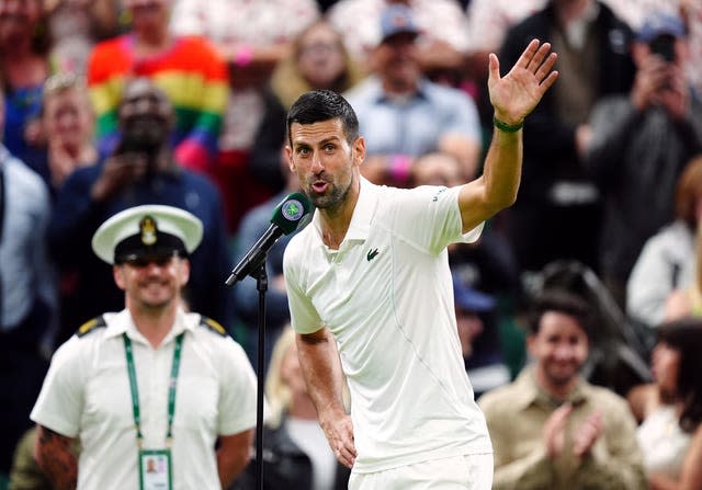 Novak Djokovic waves sarcastically at the crowd 