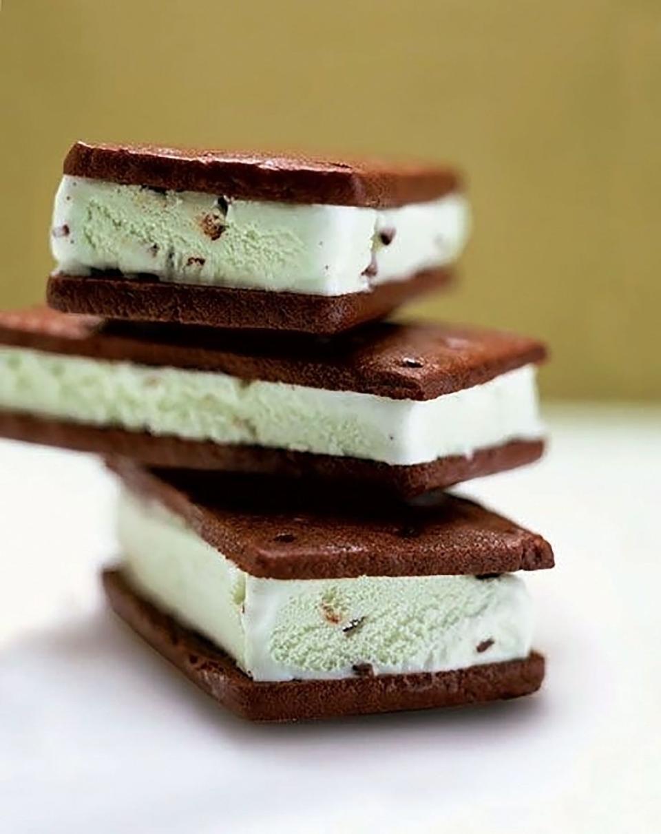 three chocolate mint sandwich cookies stacked on top of each other