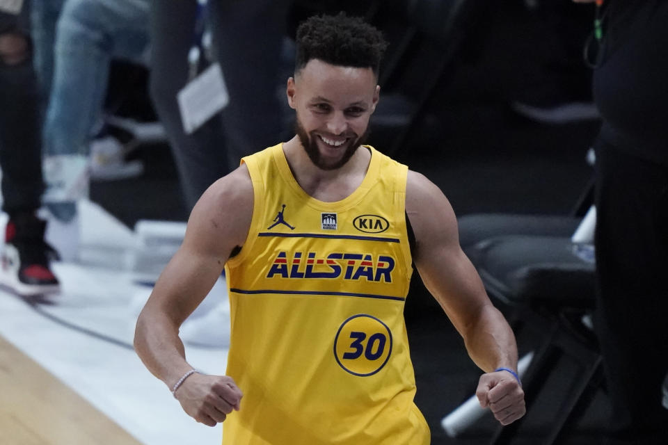 Golden State Warriors guard Stephen Curry celebrates after winning the 3-point contest at basketball's NBA All-Star Game in Atlanta, Sunday, March 7, 2021. (AP Photo/Brynn Anderson)