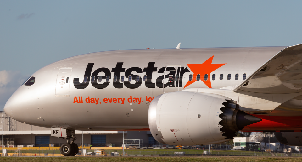 A Jetstar aircraft is seen on the tarmac.