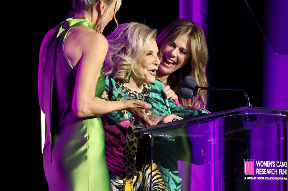 (L-R) Gala Chair Jamie Alexander Tisch and Honorary Chair Rita Wilson present the Unsung Hero Award to honoree Wallis Annenberg onstage during "An Unforgettable Evening" Benefiting The Women's Cancer Research Fund at Beverly Wilshire, A Four Seasons Hotel on April 10, 2024 in Beverly Hills, California.