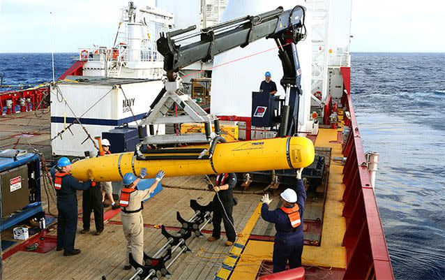 Australian forces prepare to deploy an autonomous underwater vehicle in the search of the missing Malaysia Airlines Flight 370. Source: AP Photo