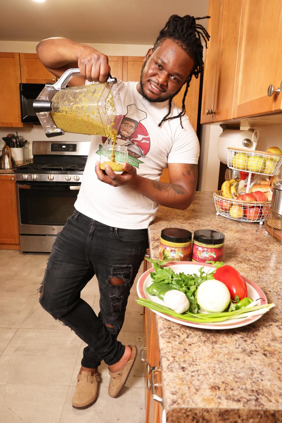 Mirbentz Jean Francois of Brockton, seen here on Saturday, Jan. 7, 2023, is founder of Did You Eat LLC, which sells its iconic Haitian seasoning sauce epis in local grocery stores.