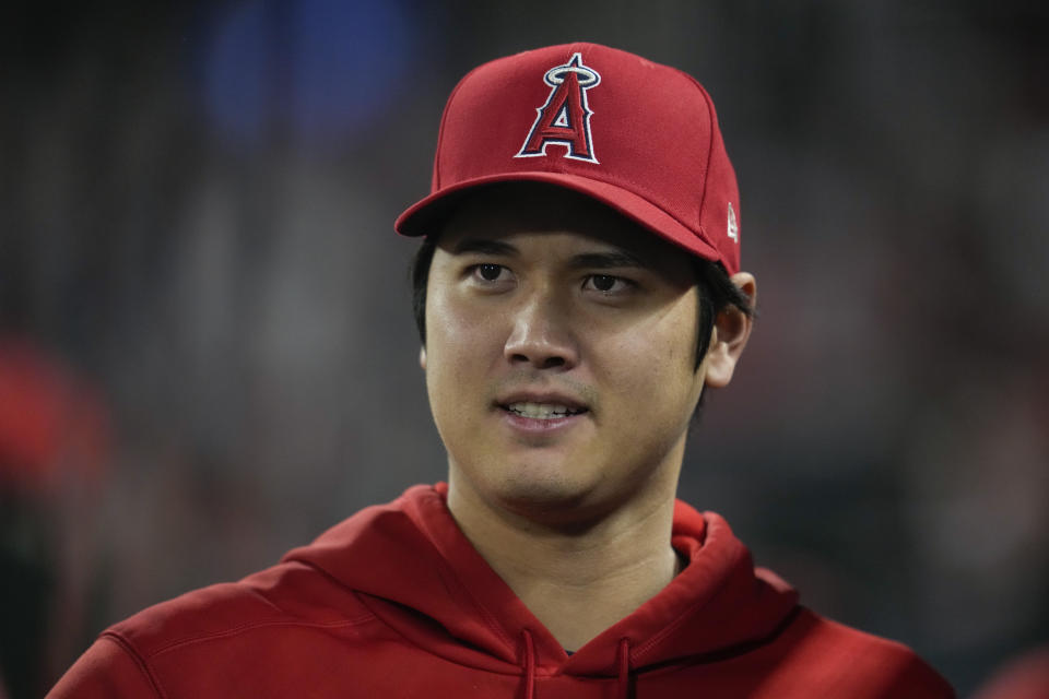 Los Angeles Angels' Shohei Ohtani stands in the dugout during the ninth inning of a baseball game against the Detroit Tigers in Anaheim, Calif., Saturday, Sept. 16, 2023. (AP Photo/Ashley Landis)