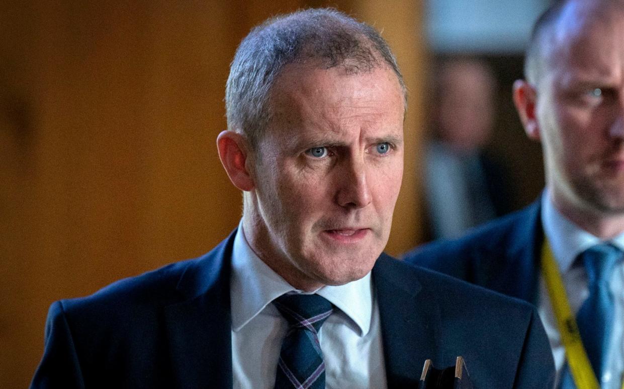 Minister for Health and Social Care Michael Matheson leaves the main chamber after First Minster's Questions at the Scottish Parliament in Holyrood, Edinburgh