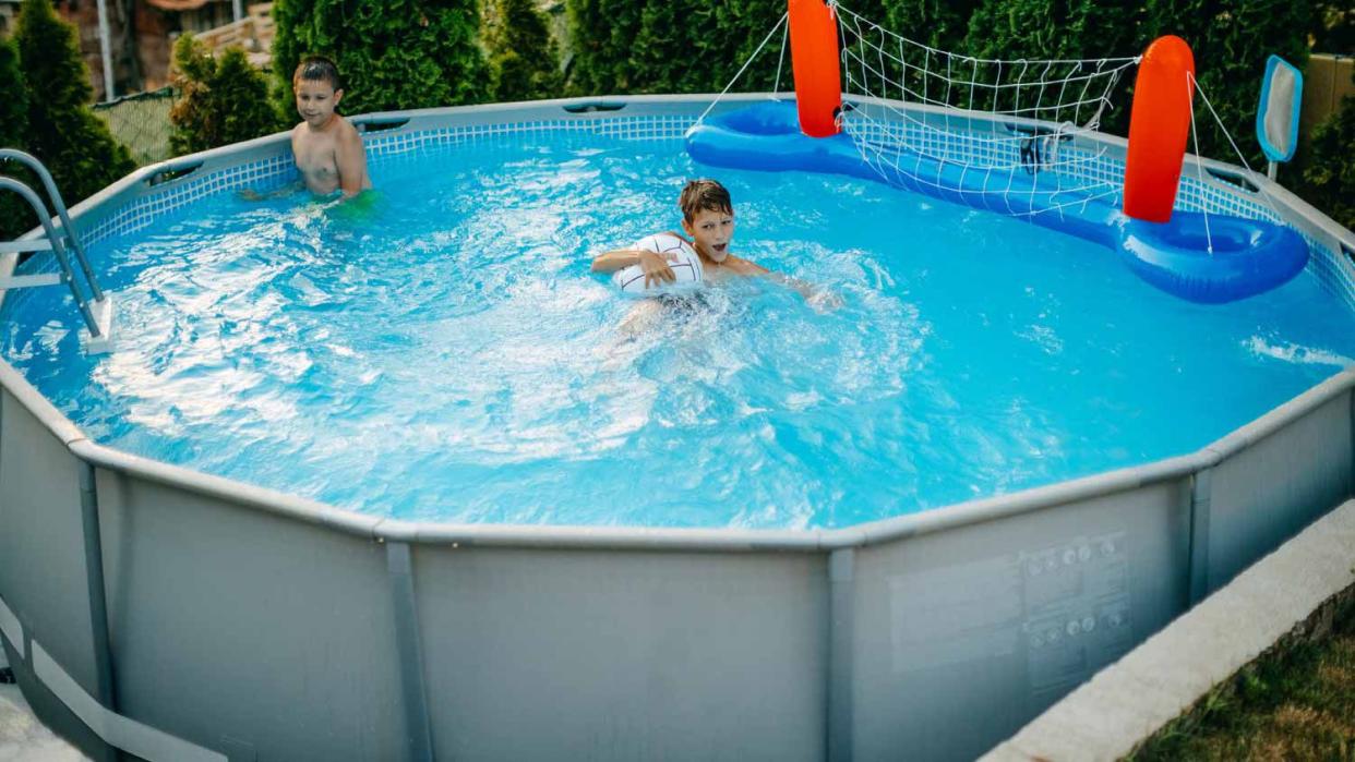 Kids playing in home swimming pool