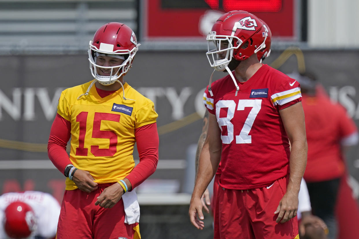 Kansas City Chiefs quarterback Patrick Mahomes (15) talks with tight end Travis Kelce (87) during practice. (AP Photo/Charlie Riedel)