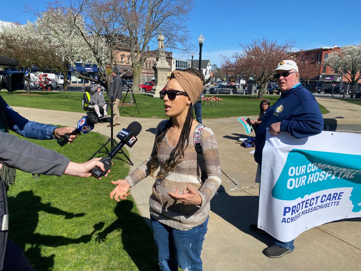 Morton Hospital registered nurse Jacqueline Fitts speaking to news outlets at the community rally to save the hospital, held on the Taunton Green on Tuesday, April 23, 2024.