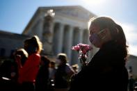 People gather in front of the U.S. Supreme Court following the death of U.S. Supreme Court Justice Ruth Bader Ginsburg, in Washington