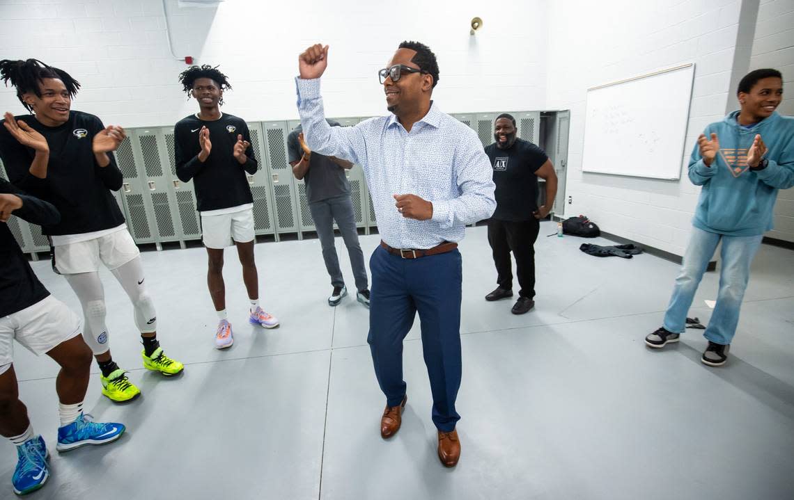 Gray Collegiate Academy War Eagles head coach Dion Bethea dances with his players in the locker room before the first ever boys varsity game at the new Gray Collegiate Academy basketball gymnasium Friday, January 13, 2023, in West Columbia, SC.