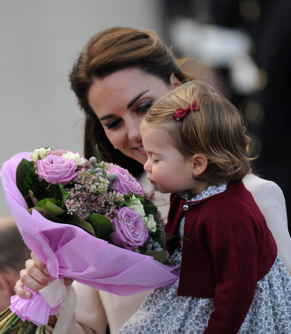 Princess Charlotte stops to smell the flowers before she and the rest of the royal family depart from Victoria and wrap up their tour of Canada’s west coast. Photo: REX/Shutterstock