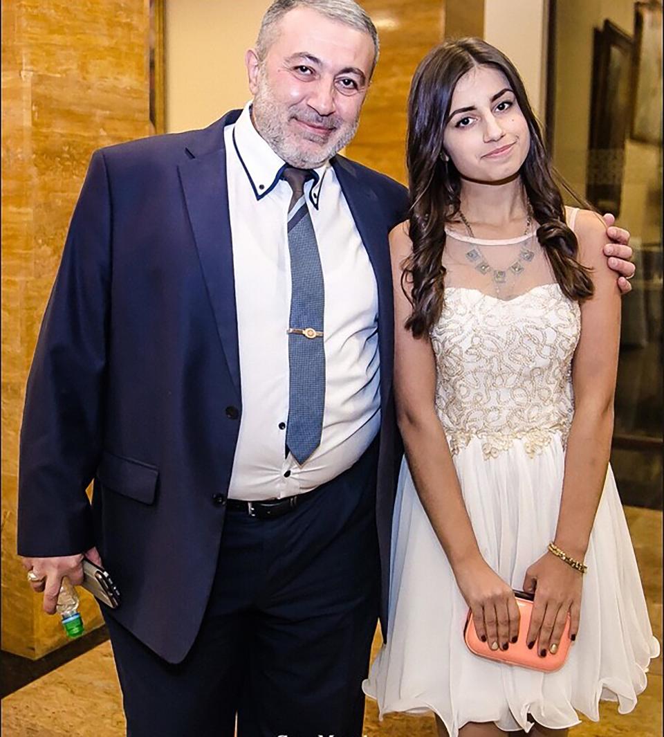 One of the daughters is seen with her dad at an event. Source: EAST2WEST/Australscope