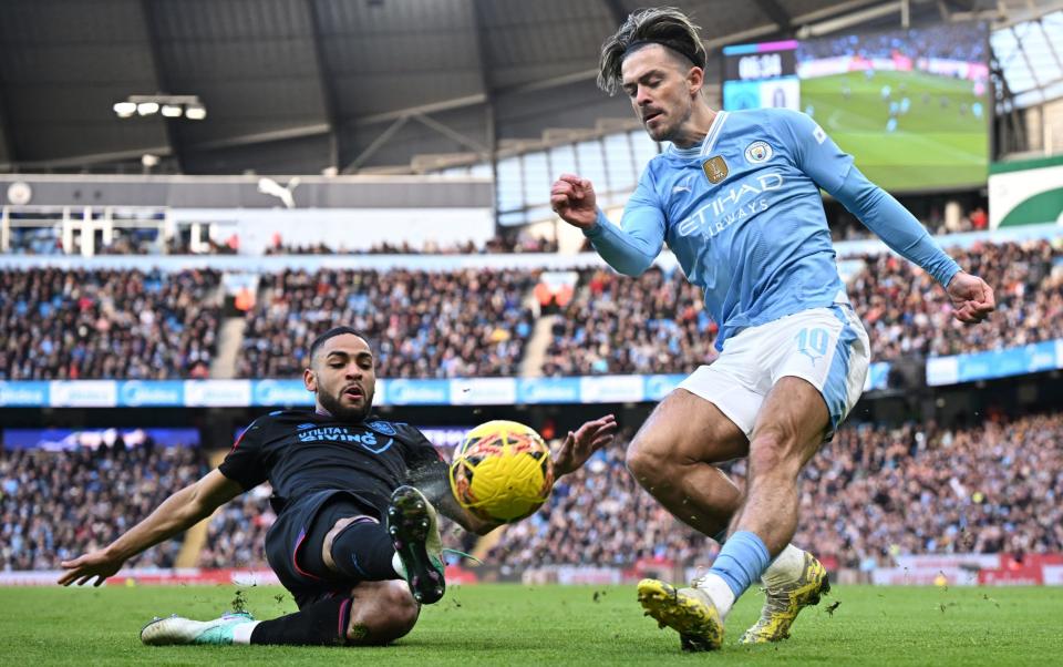 Jack Grealish crosses the ball