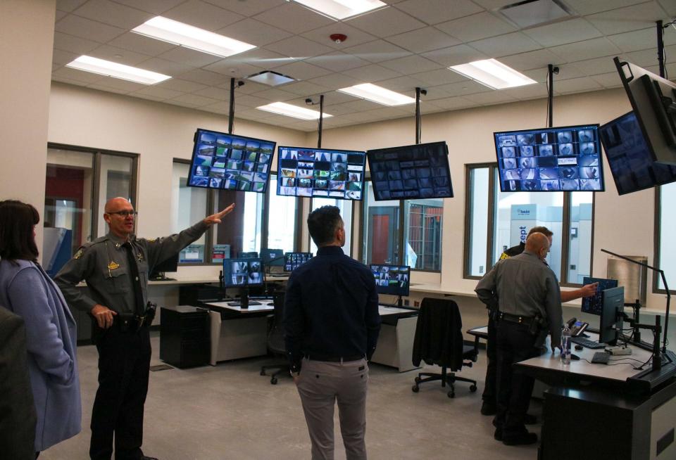 Jim Hughes, operations captain of the Saline County Sheriff's Office, discusses the new cameras and technology the jail is equipped with on a tour of the facility.