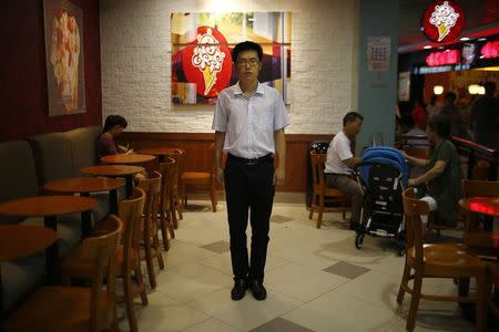 Zhang Haoran, who was born in 1990, poses for a photograph in Shanghai August 22, 2014. REUTERS/Carlos Barria