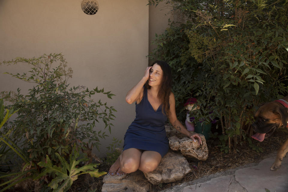 Idit Harel Segal, who donated a kidney to a Palestinian child from the Gaza Strip, poses for a portrait in her home in Eshhar, northern Israel, Tuesday, July 13, 2021. (AP Photo/Maya Alleruzzo)