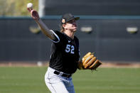 Chicago White Sox starting pitcher Mike Clevinger (52) works out during a spring training baseball practice, Wednesday, Feb. 15, 2023, in Phoenix. (AP Photo/Matt York)