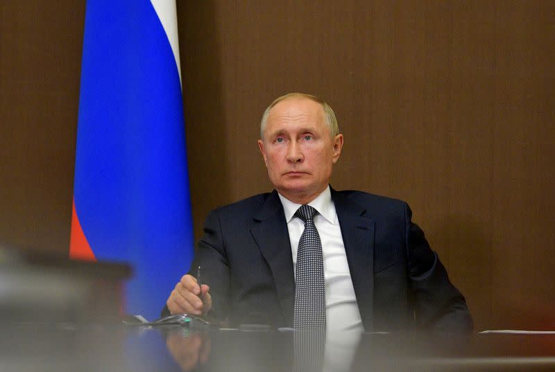 FILE PHOTO: Russian President Vladimir Putin chairs a meeting via video conference call in Sochi, Russia