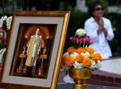 A woman mourns the death of Thailand's King Bhumibol Adulyadej at Bangkok's Siriraj Hospital