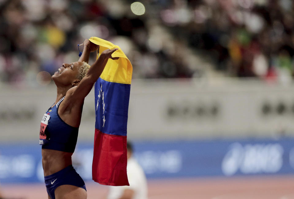 Yulimar Rojas, of Venezuela celebrates after taking the gold medal in the women's triple jump final at the World Athletics Championships in Doha, Qatar, Saturday, Oct. 5, 2019. (AP Photo/Nariman El-Mofty)