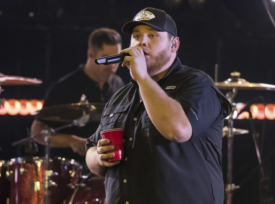 FILE - This Nov. 14, 2018 file photo shows Luke Combs performing at the 52nd annual CMA Awards in Nashville, Tenn. Combs, Brothers Osborne, Miranda Lambert, Maren Morris and Zac Brown Band are the leading nominees at this year’s CMT Awards with three each. (Photo by Charles Sykes/Invision/AP, File)