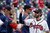 Atlanta Braves' Dansby Swanson (7) high fives his teammates after defeating the Washington Nationals 5-1 in a baseball game Thursday, June 3, 2021, in Atlanta. (AP Photo/John Bazemore)