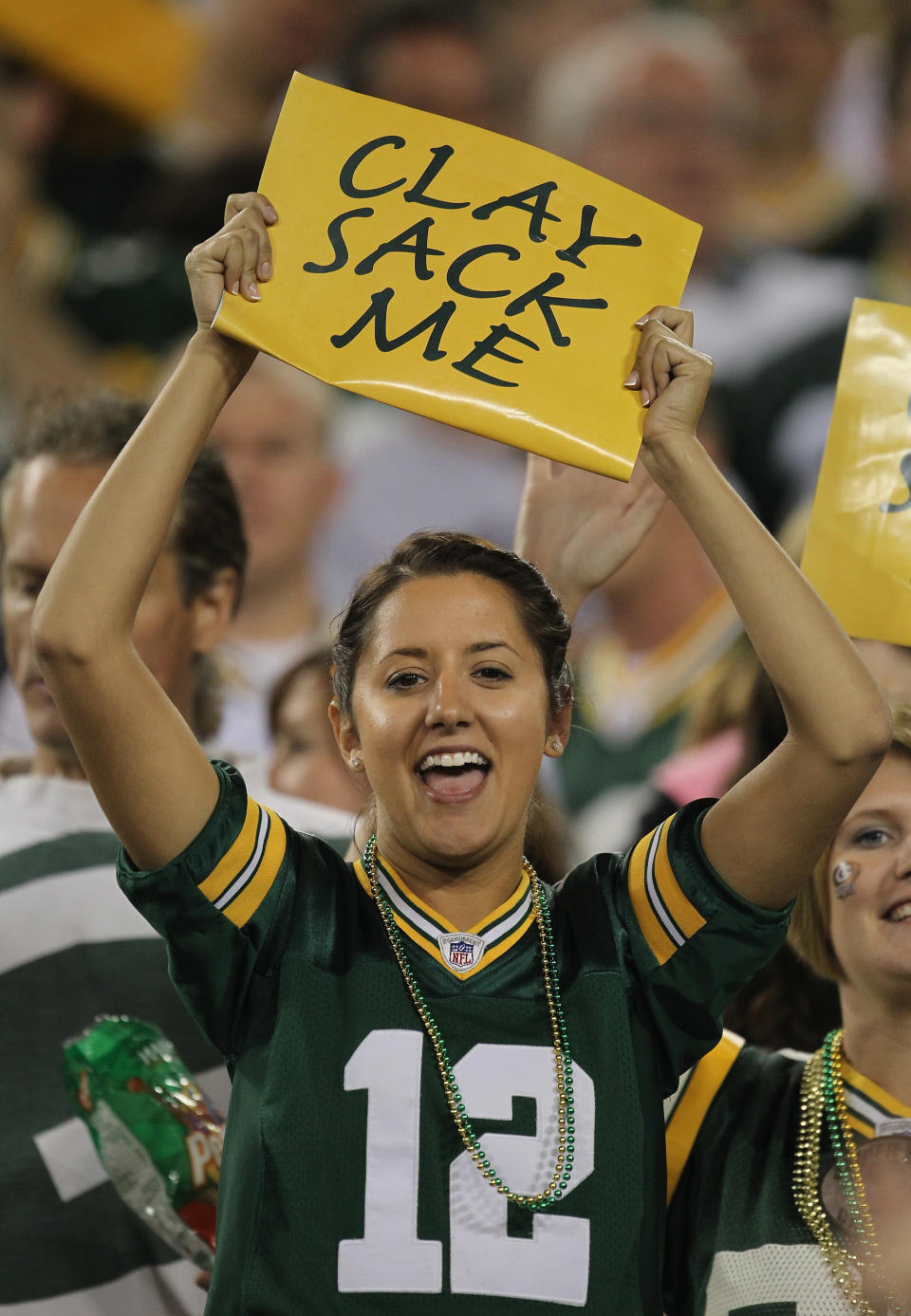 GREEN BAY, WI - SEPTEMBER 08: A fan of the Green Bay Packers holds a sign during the NFL opening season game against the New Orleans Saints at Lambeau Field on September 8, 2011 in Green Bay, Wisconsin. The Packers defeated the Saints 42-34. (Photo by Jonathan Daniel/Getty Images)