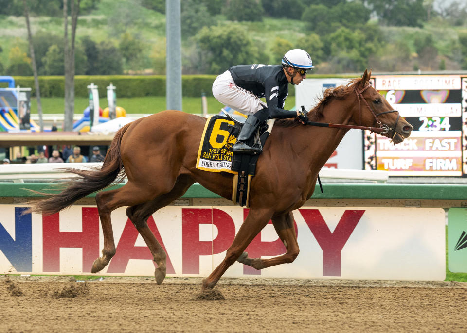 In a photo provided by Benoit Photo, Forbidden Kingdom and jockey Juan Hernandez win the Grade II, $400,000 San Felipe Stakes horse race Saturday, March 5, 2022, at Santa Anita in Arcadia, Calif. (Benoit Photo via AP)