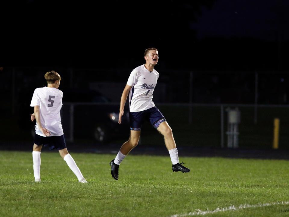 Jude Garber celebrates with classmate Clayton Blackburn, left, after converting a free kick in the second half Morgan's 2-0 loss to host Philo on Thursday in Duncan Falls. The goal did not count, due to the ball reaching the net before hitting another player.