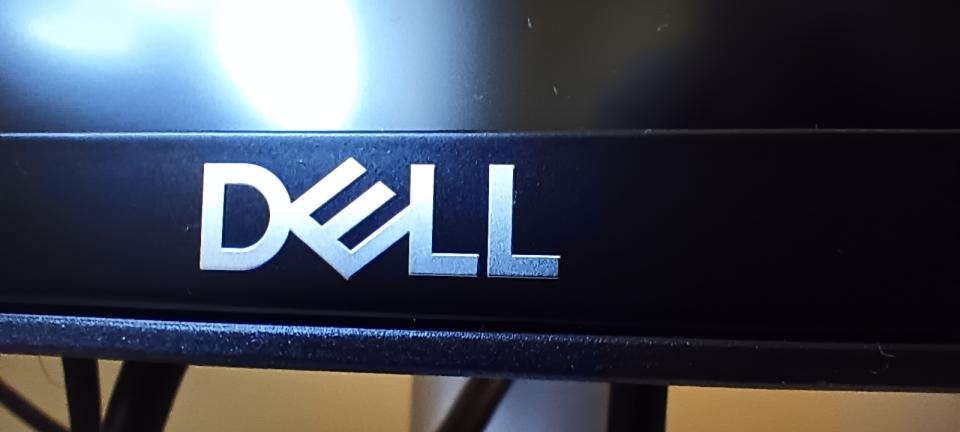 A Dell UltraSharp U4924DW monitor sitting on a desk