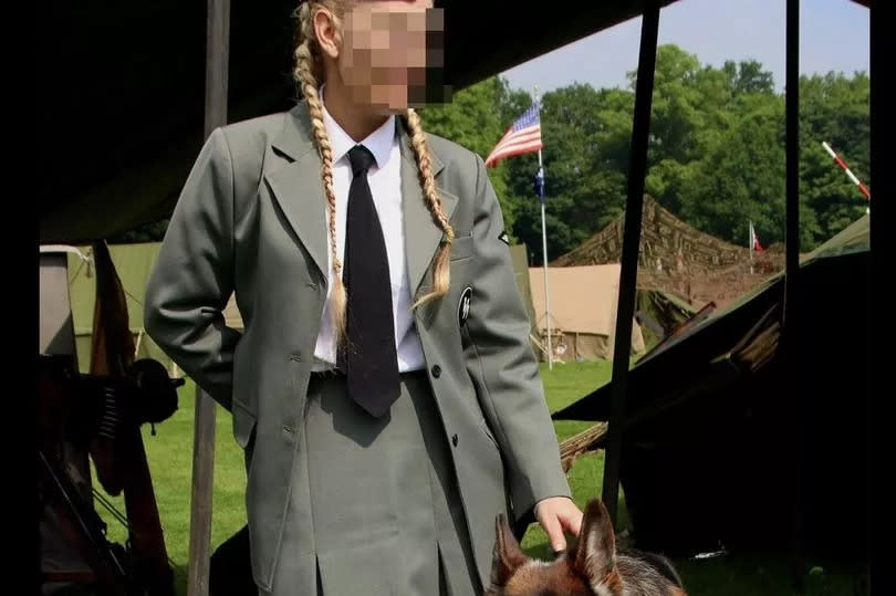 Dr Beorn described this woman's outfit as similar to that of a concentration camp guard