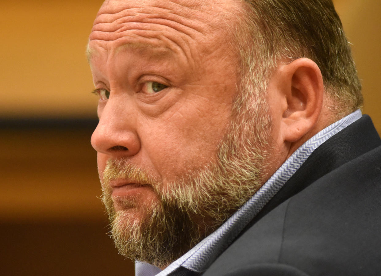 Alex Jones appears on the witness stand while testifying at his defamation trial at Connecticut Superior Court