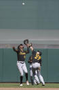 ADDS SECOND SENTENCE ABOUT THE ERROR RULING BEING CHANGED TO AN RBI-DOUBLE - Pittsburgh Pirates shortstop Oneil Cruz (15), second baseman Kevin Newman (27) and center fielder Greg Allen, rear, look up toward a San Francisco Giants' Brandon Crawford pop fly that Newman made an error on allowing Giants' Wilmer Flores to score during the seventh inning of a baseball game in San Francisco, Sunday, Aug. 14, 2022. The play was initially ruled an error on Newman but changed to an RBI-double by Crawford. (AP Photo/Jeff Chiu)