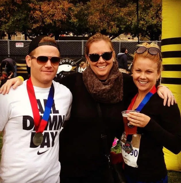 The author, right, with her brother and cousin after completing the Chicago Marathon. (Photo: Courtesy of Claire Cook)