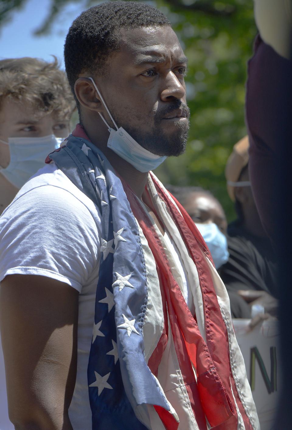 Shan Jones, 33, listens to speakers in Perry Square on June 6, 2020, in Erie, Pa. More than 2,000 people gathered to protest the killing of George Floyd on Memorial Day in Minneapolis.